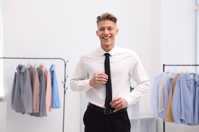 Photo of Happy man in formal attire at atelier