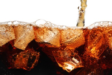 Photo of Pouring refreshing cola into glass with ice isolated on white