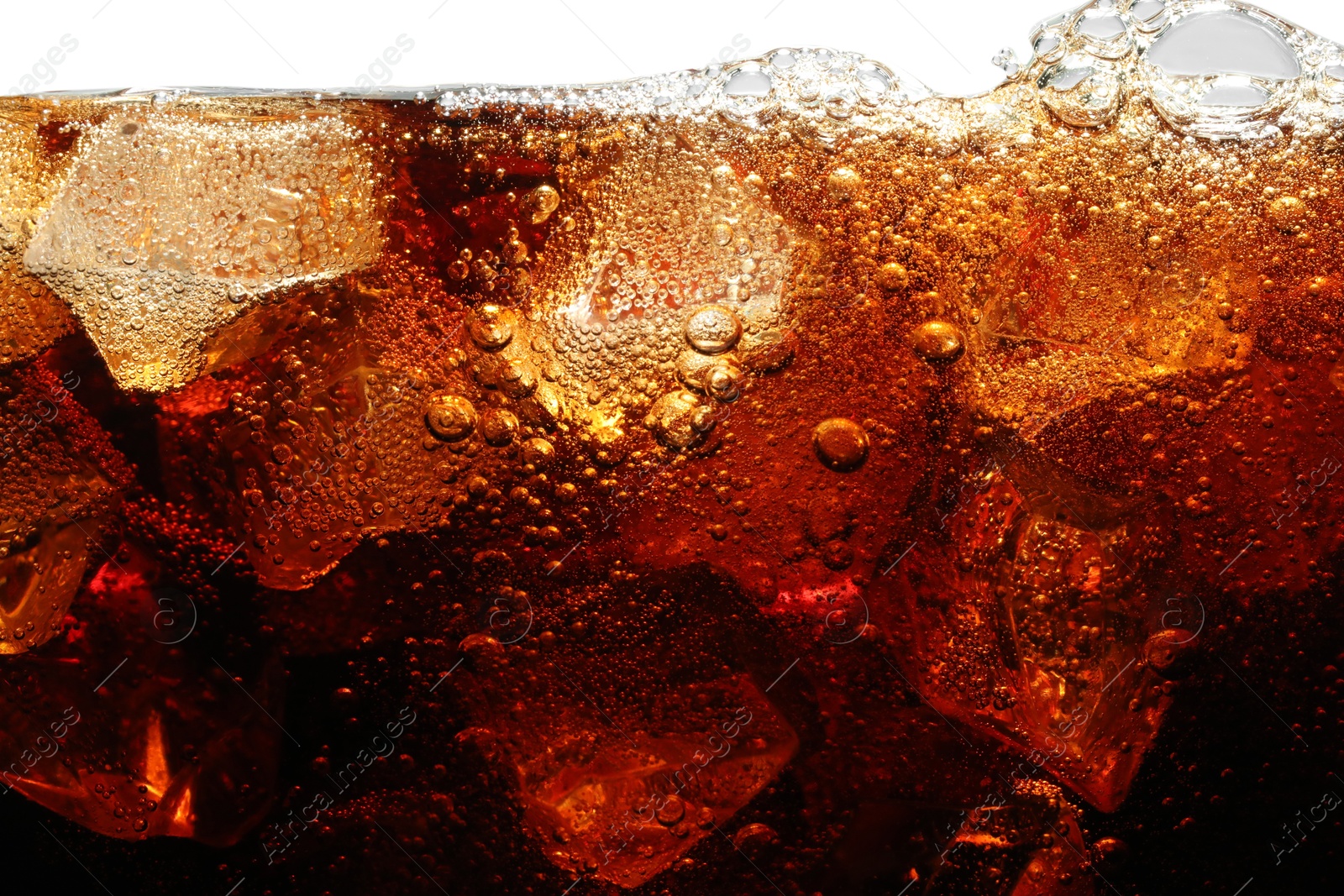 Refreshing cola with ice isolated on white Photo of Refreshing cola with ice isolated on white