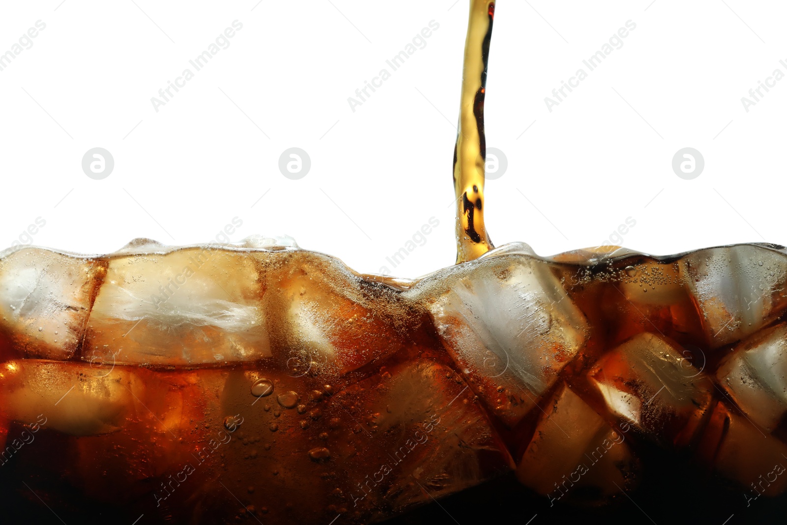 Pouring refreshing cola into glass with ice isolated on white Photo of Pouring refreshing cola into glass with ice isolated on white