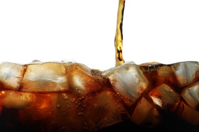 Photo of Pouring refreshing cola into glass with ice isolated on white