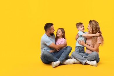 Photo of Happy family on yellow background. Space for text