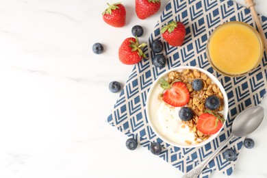 Photo of Tasty yogurt with granola, berries and honey on white marble table, flat lay. Space for text
