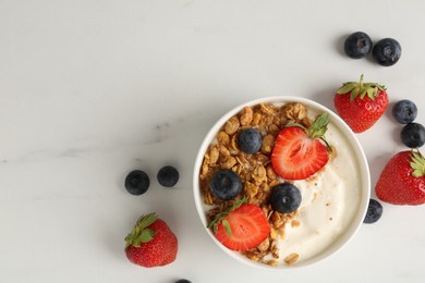 Photo of Tasty yogurt with granola and berries on white marble table, flat lay. Space for text