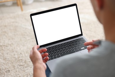 Photo of Man having online consultation with doctor via laptop at home, closeup