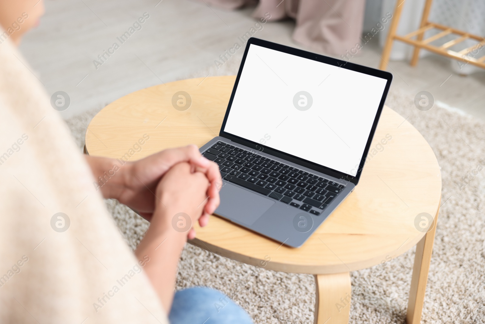 Photo of Man having online consultation with doctor via laptop at home, closeup