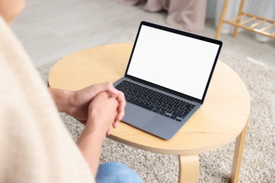 Photo of Man having online consultation with doctor via laptop at home, closeup