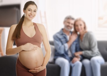 Image of Surrogate mother and intended parents indoors, selective focus