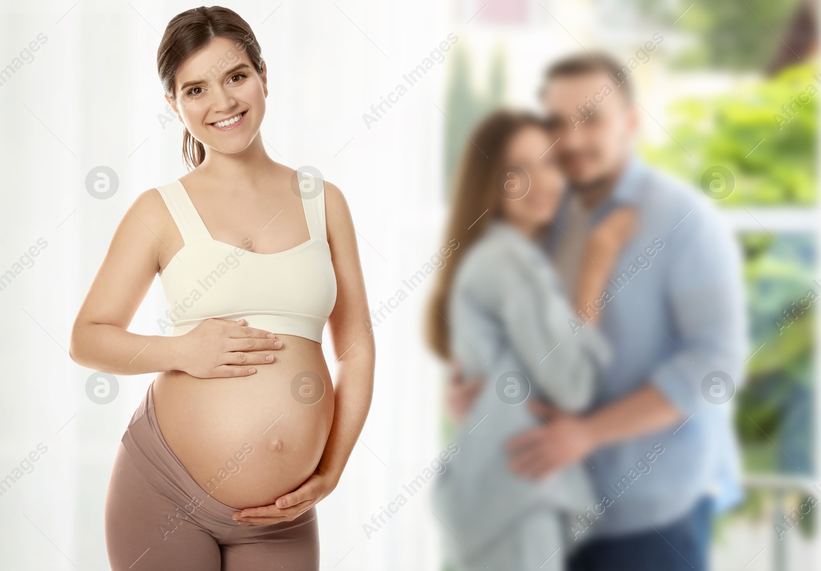 Surrogate mother and intended parents indoors, selective focus Image of Surrogate mother and intended parents indoors, selective focus