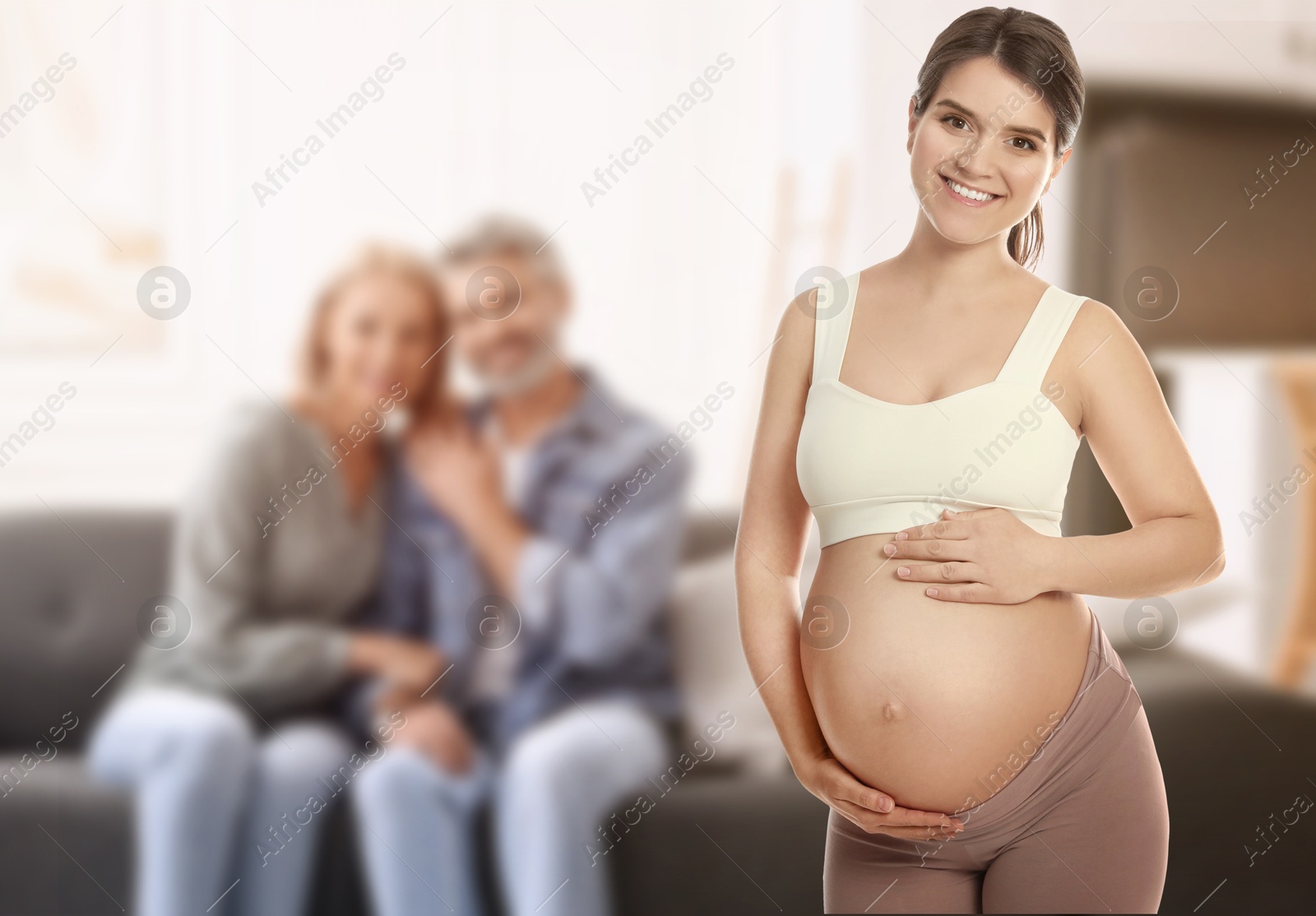 Surrogate mother and intended parents indoors, selective focus Image of Surrogate mother and intended parents indoors, selective focus
