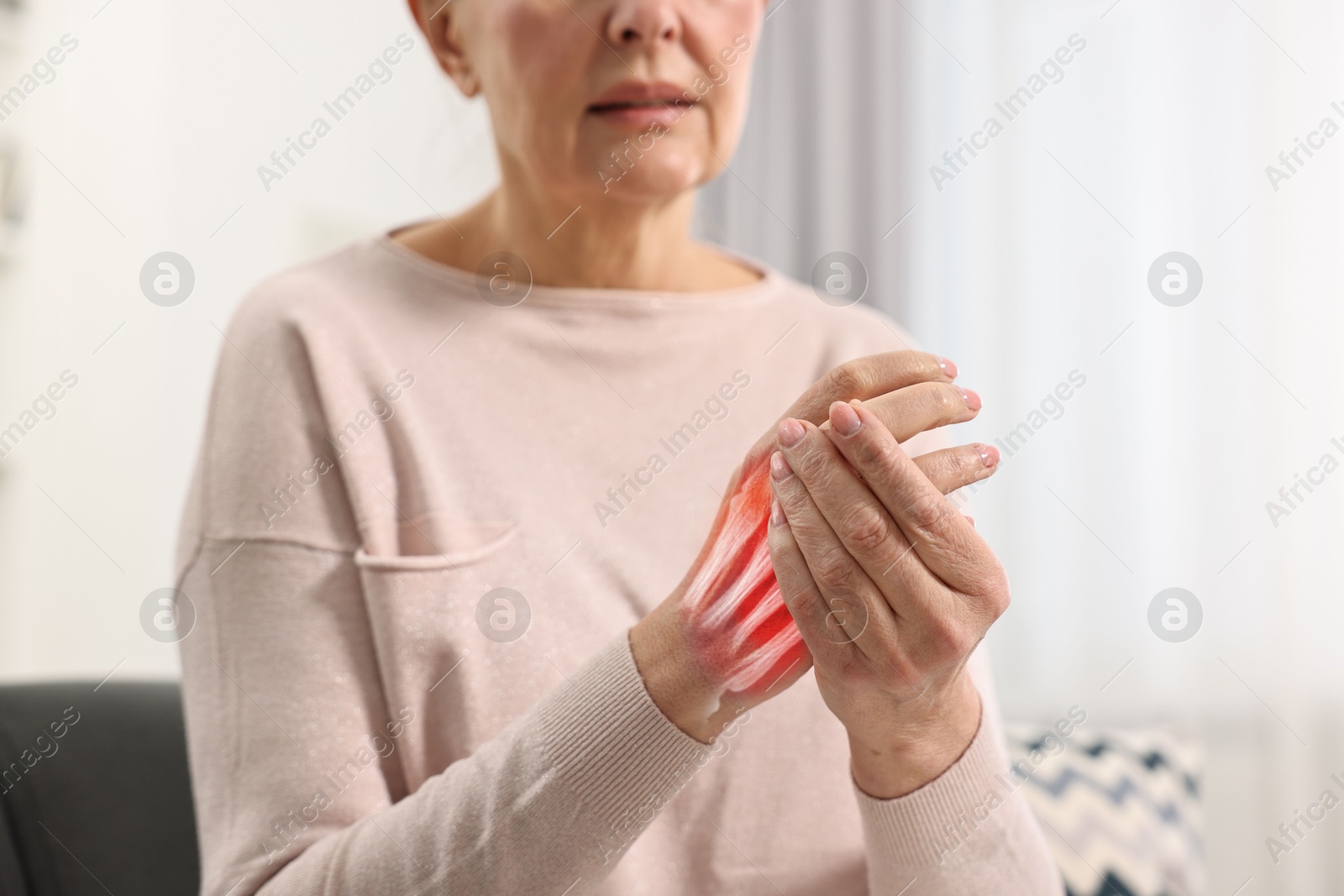 Arthritis. Senior woman suffering from pain in hand indoors, closeup. Illustration of joint inflammation Image of Arthritis. Senior woman suffering from pain in hand indoors, closeup. Illustration of joint inflammation