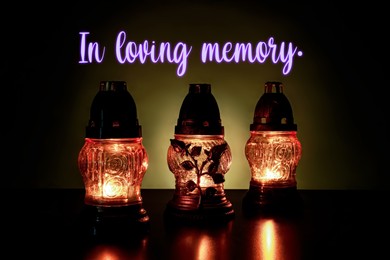 Image of In loving memory. Glowing grave lights on table in darkness