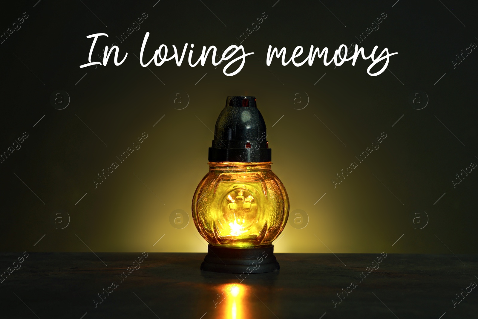 In loving memory. Glowing yellow grave light on table in darkness Image of In loving memory. Glowing yellow grave light on table in darkness