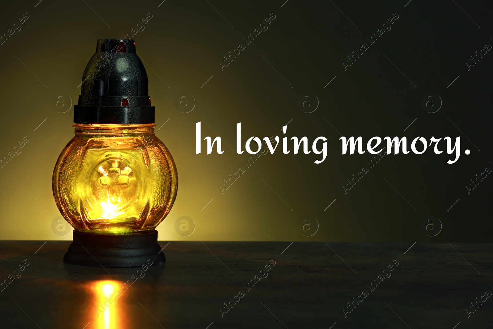 In loving memory. Glowing yellow grave light on table in darkness Image of In loving memory. Glowing yellow grave light on table in darkness