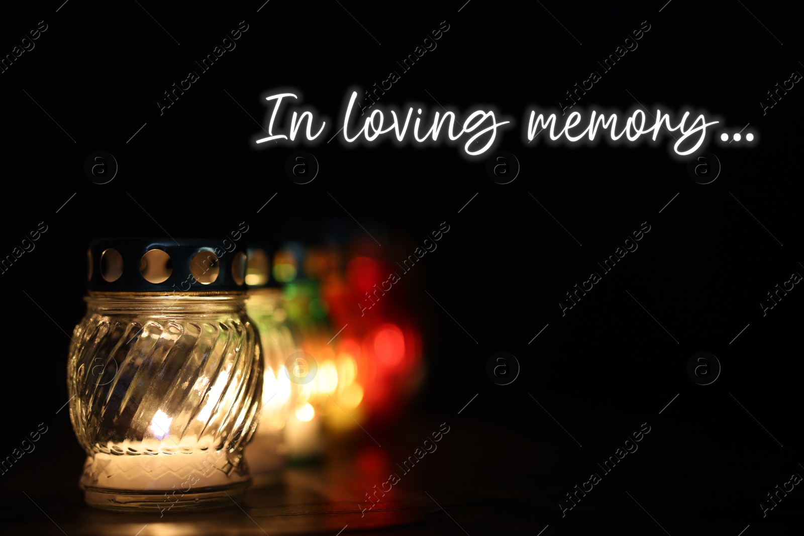 In loving memory. Many grave lights on table in darkness Image of In loving memory. Many grave lights on table in darkness