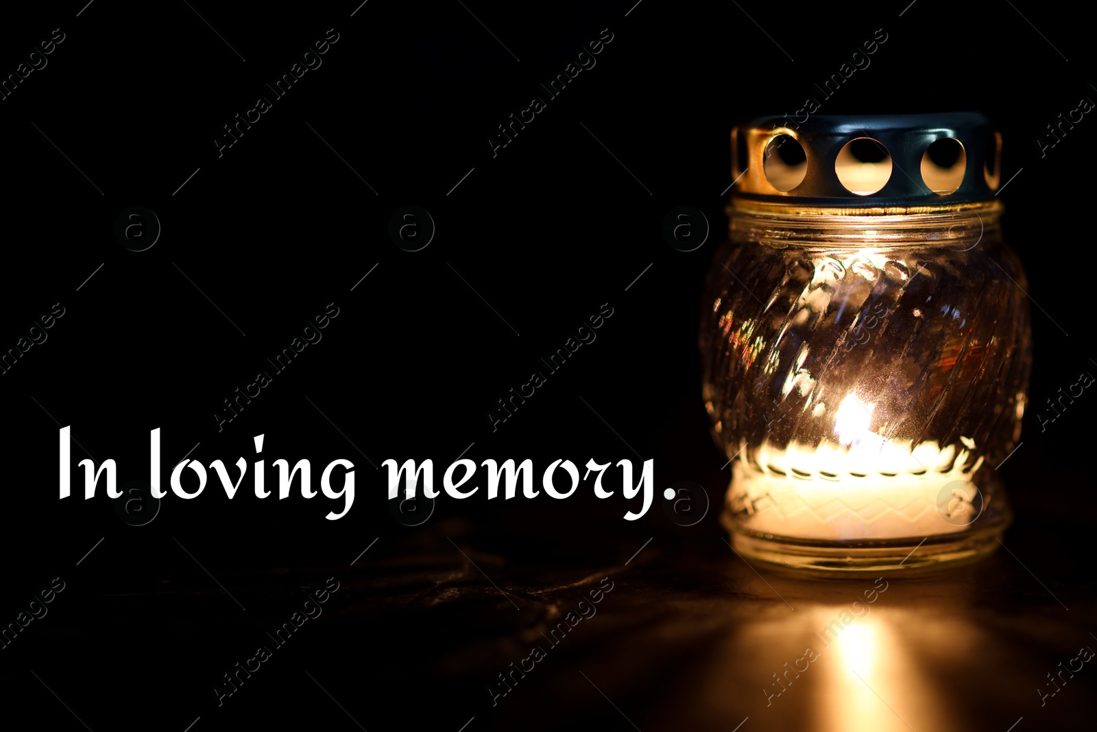 In loving memory. Grave light with burning candle on table in darkness Image of In loving memory. Grave light with burning candle on table in darkness