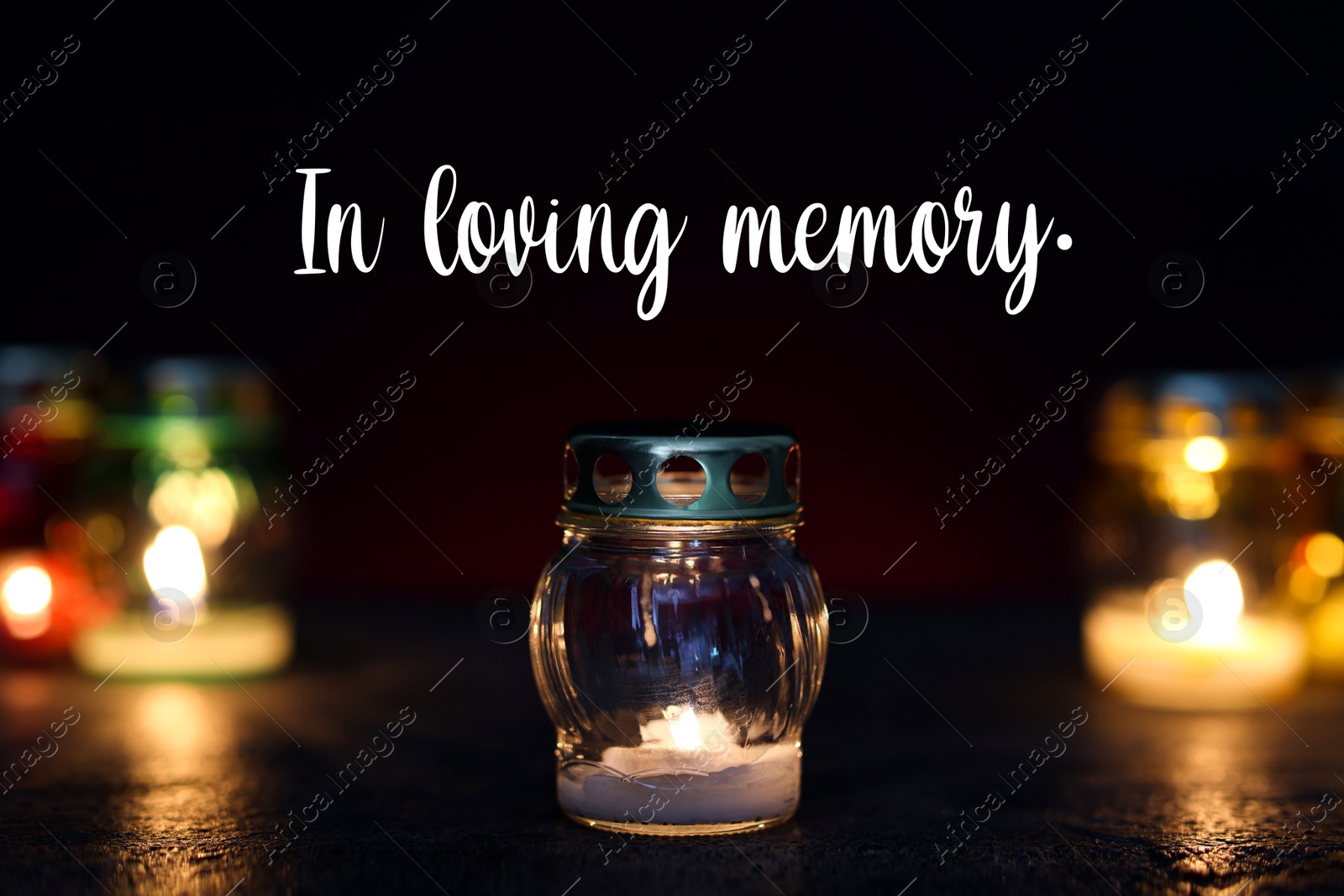 In loving memory. Many different grave lights on table in darkness Image of In loving memory. Many different grave lights on table in darkness
