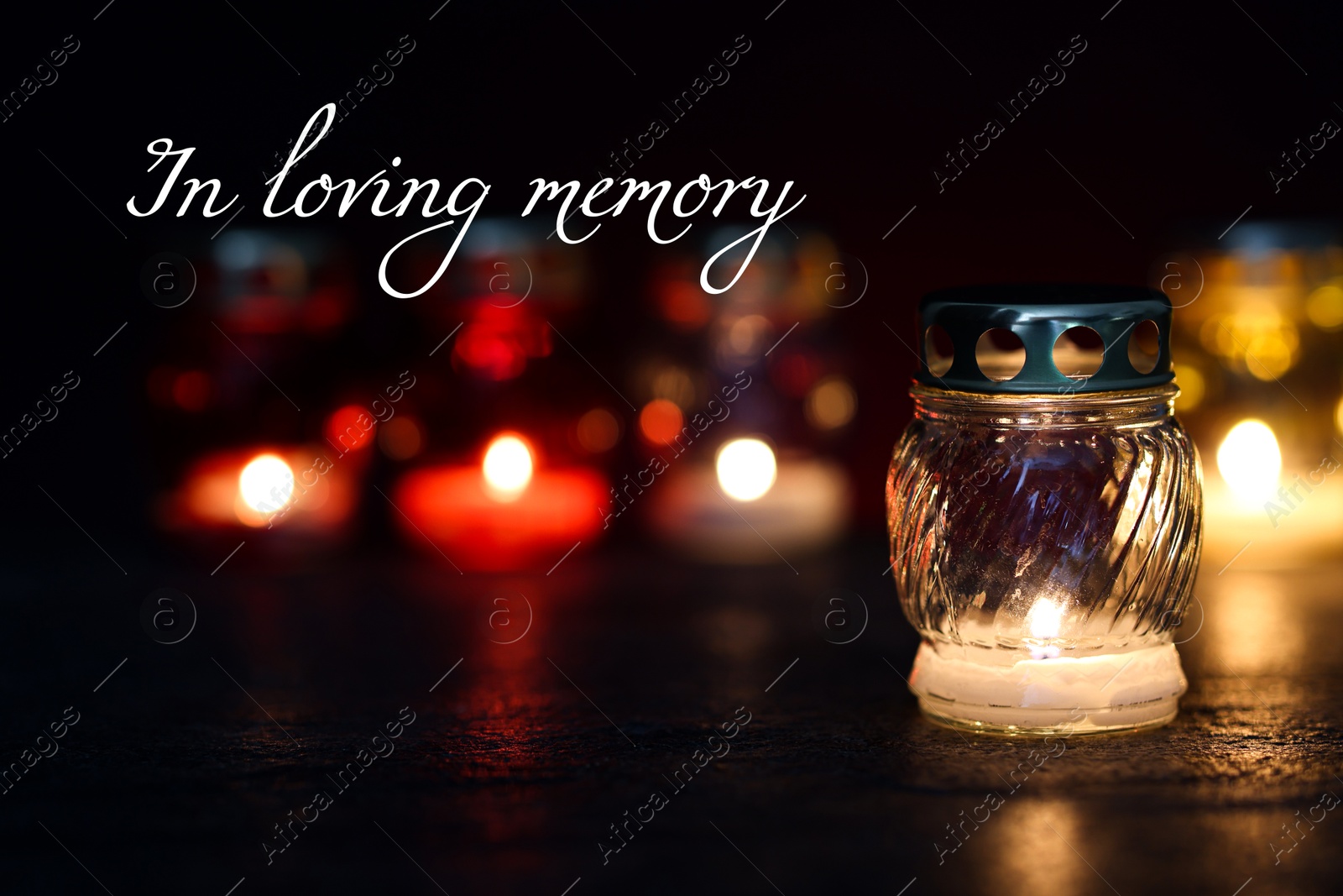 In loving memory. Many different grave lights on table in darkness Image of In loving memory. Many different grave lights on table in darkness