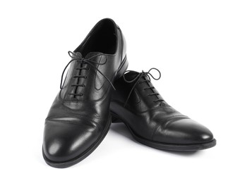 Photo of Pair of black leather shoes on white background