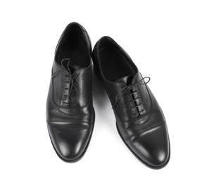 Photo of Pair of black leather shoes on white background, above view
