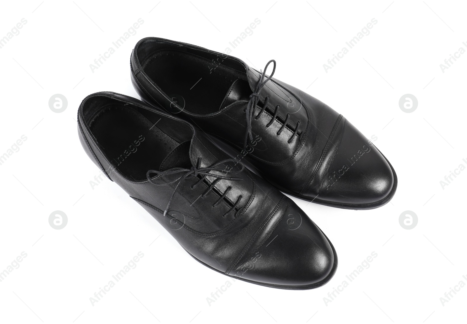 Photo of Pair of black leather shoes on white background, top view