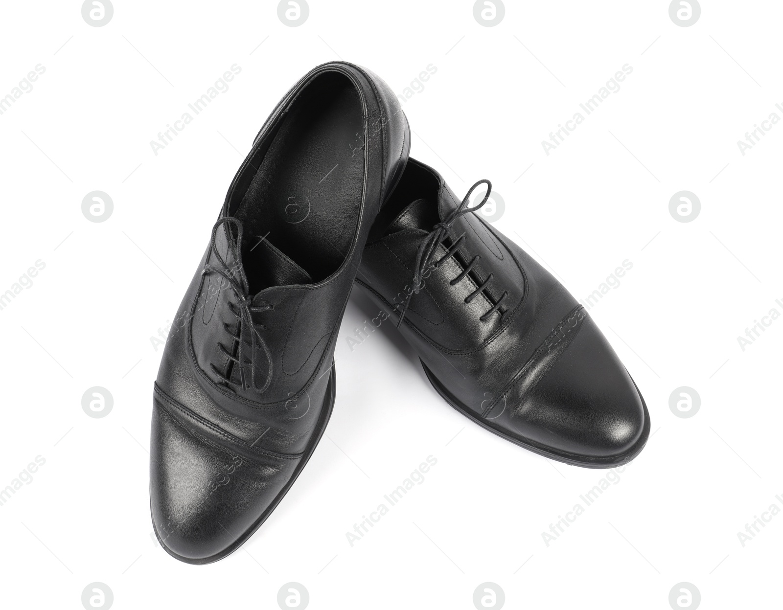 Photo of Pair of black leather shoes on white background, top view