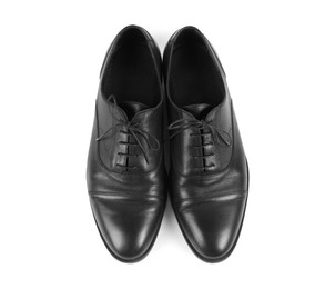 Photo of Pair of black leather shoes on white background, top view
