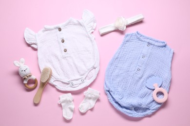 Photo of Baby clothes and accessories on pink background, flat lay