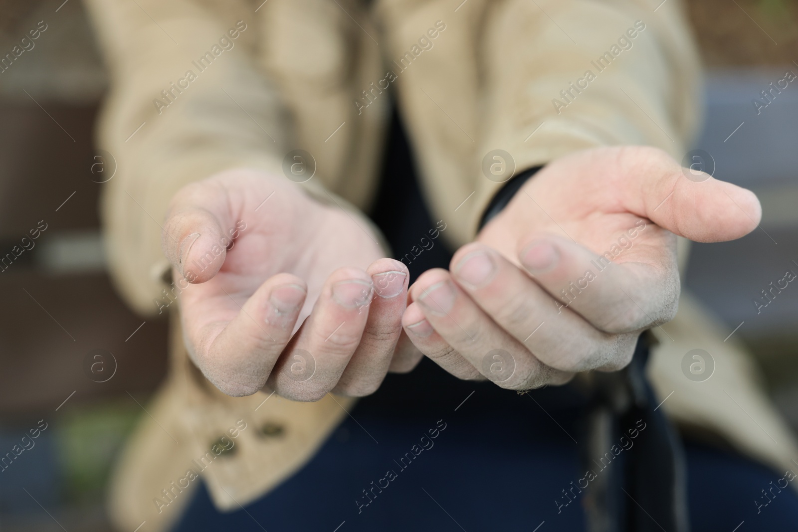 Homeless man begging for money outdoors, selective focus Photo of Homeless man begging for money outdoors, selective focus