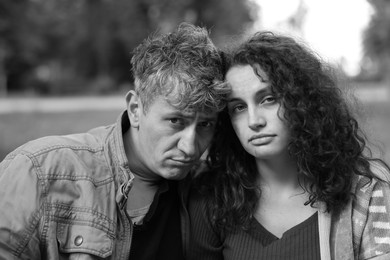 Photo of Portrait of homeless people outdoors. Black and white effect