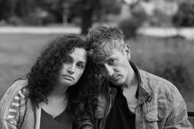 Photo of Portrait of homeless people outdoors. Black and white effect