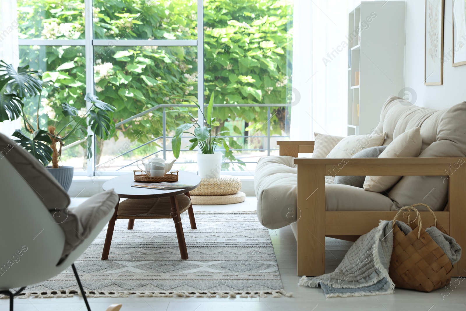 Photo of Coffee table, sofa and decor in dining room. Interior design