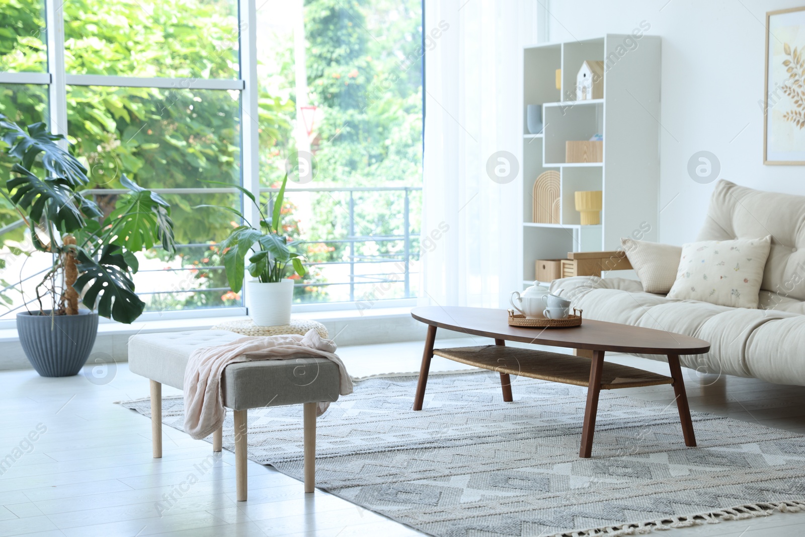 Photo of Coffee table, sofa and decor in dining room. Interior design