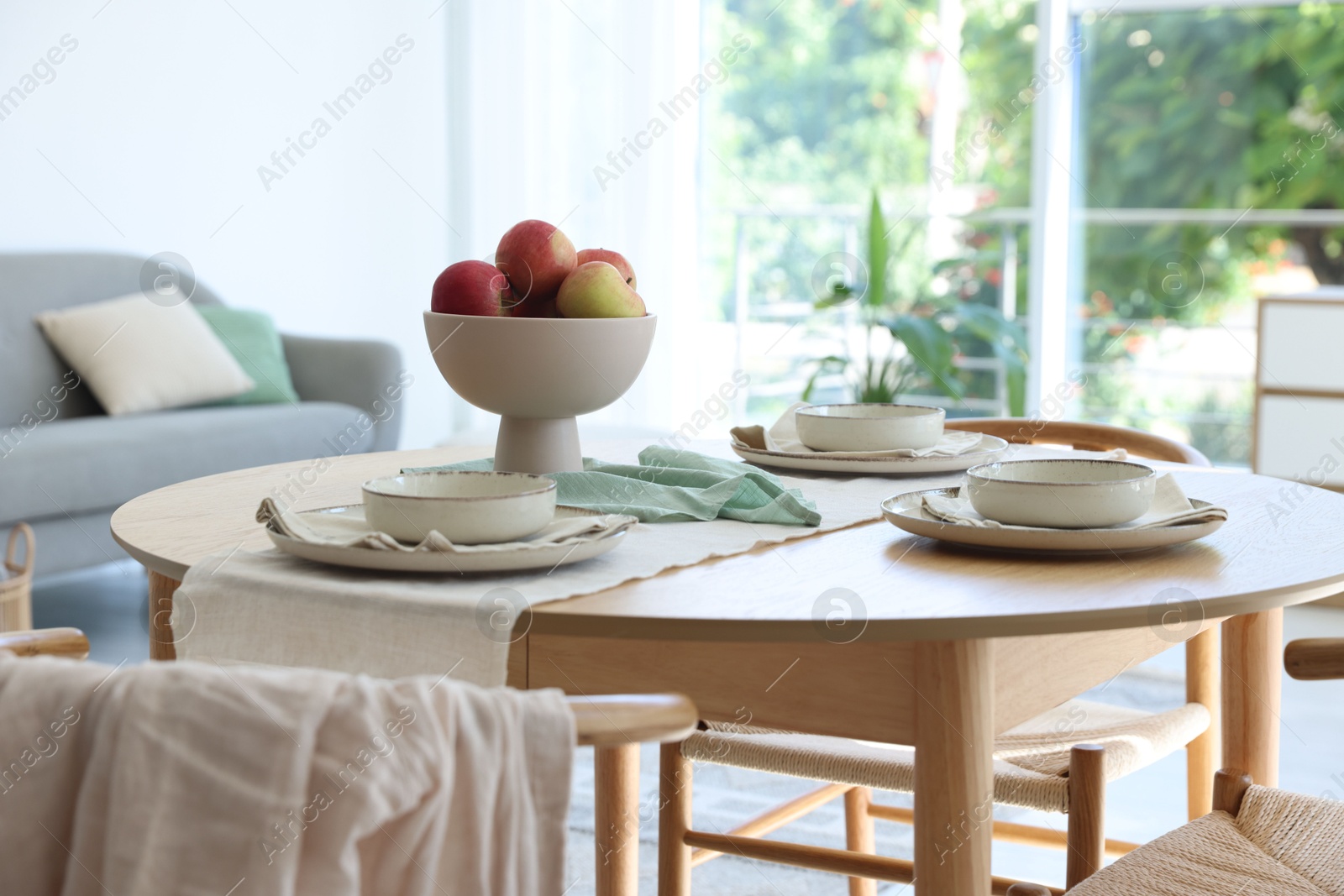 Stylish table setting, chairs and decor in dining room Photo of Stylish table setting, chairs and decor in dining room