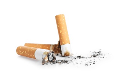 Photo of Cigarette butts with ash isolated on white
