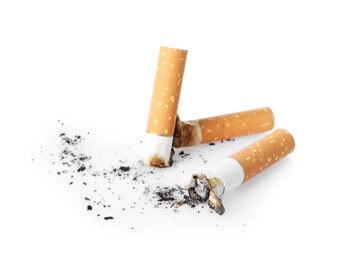 Photo of Cigarette butts with ash isolated on white