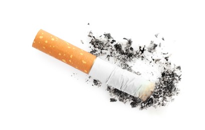 Photo of Cigarette butt with ash isolated on white, top view