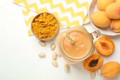 Photo of Superfood. Tasty smoothie and ingredients on white table, flat lay. Space for text