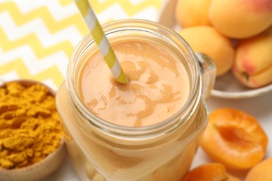 Photo of Superfood. Tasty smoothie and ingredients on table, closeup