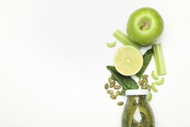 Photo of Superfood. Tasty smoothie in glass bottle and ingredients on white table, flat lay. Space for text