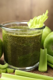 Photo of Superfood. Tasty smoothie in glass and ingredients on table, closeup