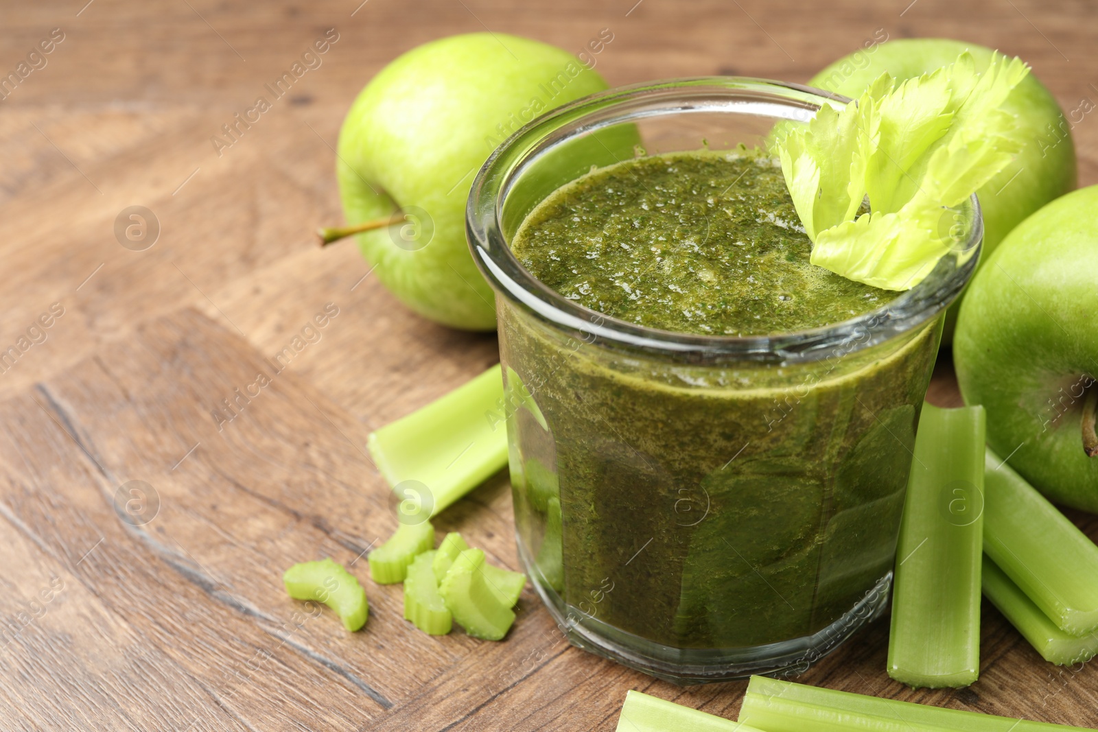 Superfood. Tasty smoothie in glass and ingredients on wooden table, closeup. Space for text Photo of Superfood. Tasty smoothie in glass and ingredients on wooden table, closeup. Space for text