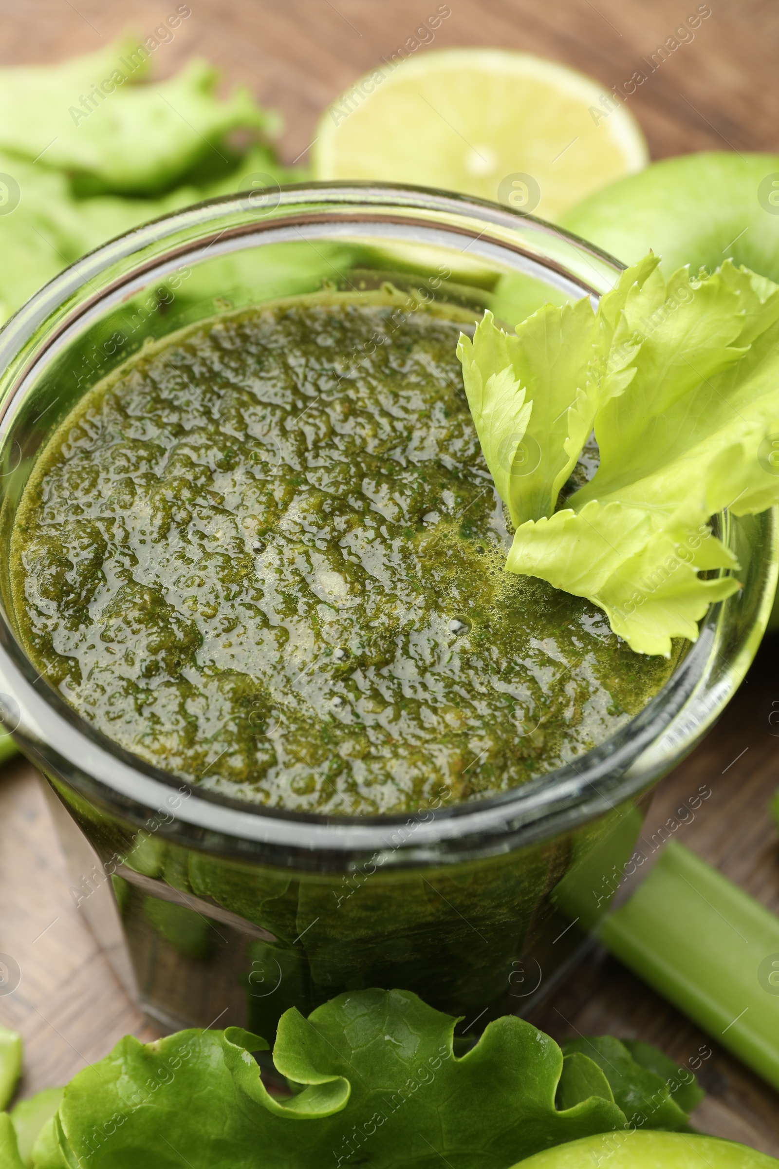 Superfood. Tasty smoothie in glass and ingredients on table, closeup Photo of Superfood. Tasty smoothie in glass and ingredients on table, closeup