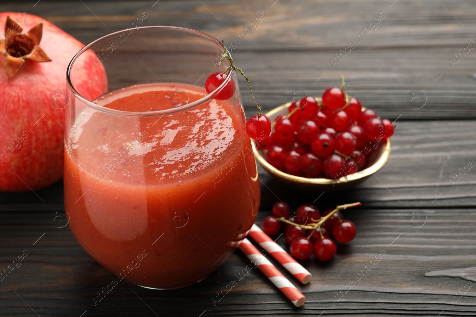Superfood. Tasty smoothie in glass and ingredients on wooden table, closeup Photo of Superfood. Tasty smoothie in glass and ingredients on wooden table, closeup