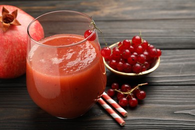 Photo of Superfood. Tasty smoothie in glass and ingredients on wooden table, closeup