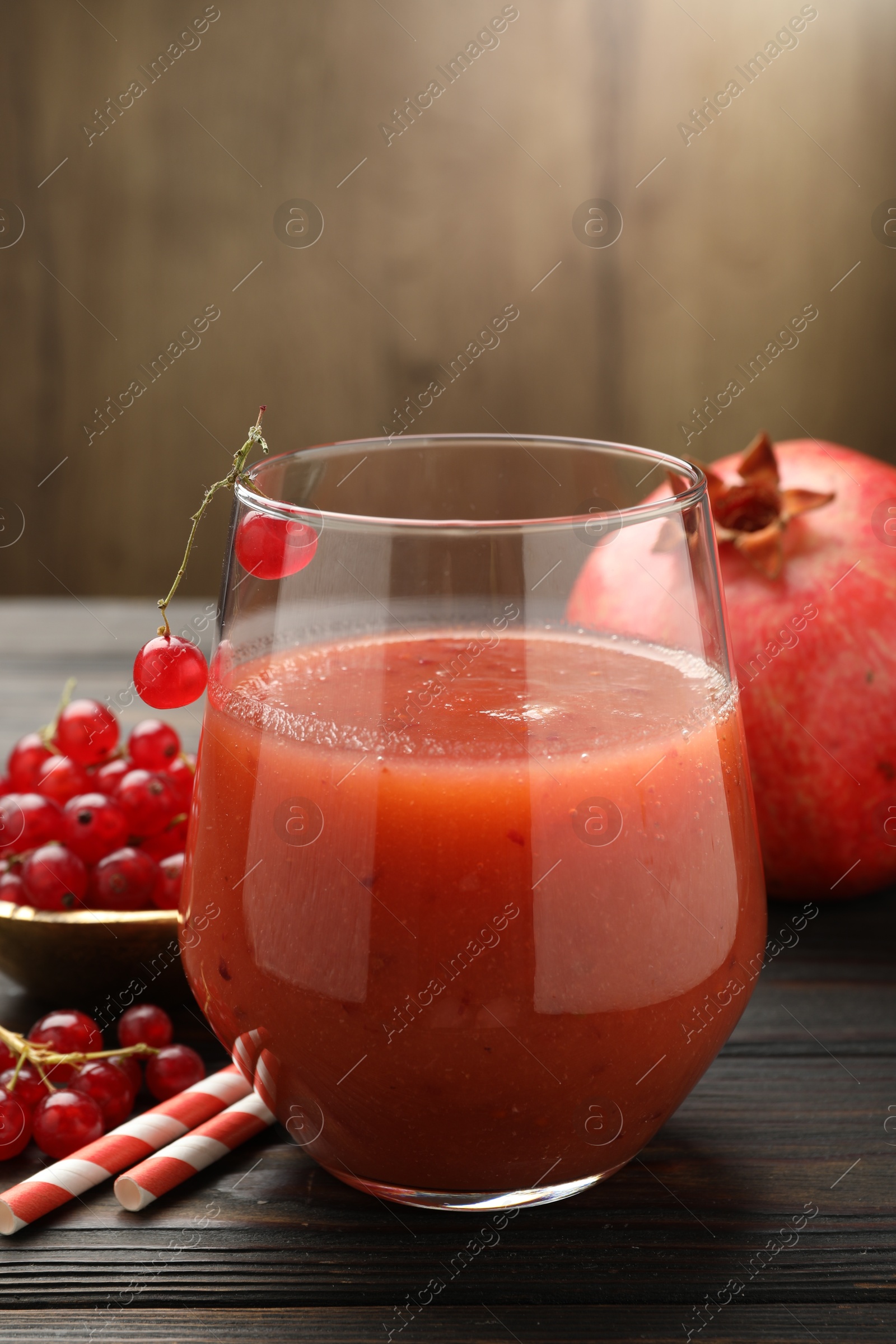 Superfood. Tasty smoothie in glass and ingredients on wooden table, closeup Photo of Superfood. Tasty smoothie in glass and ingredients on wooden table, closeup