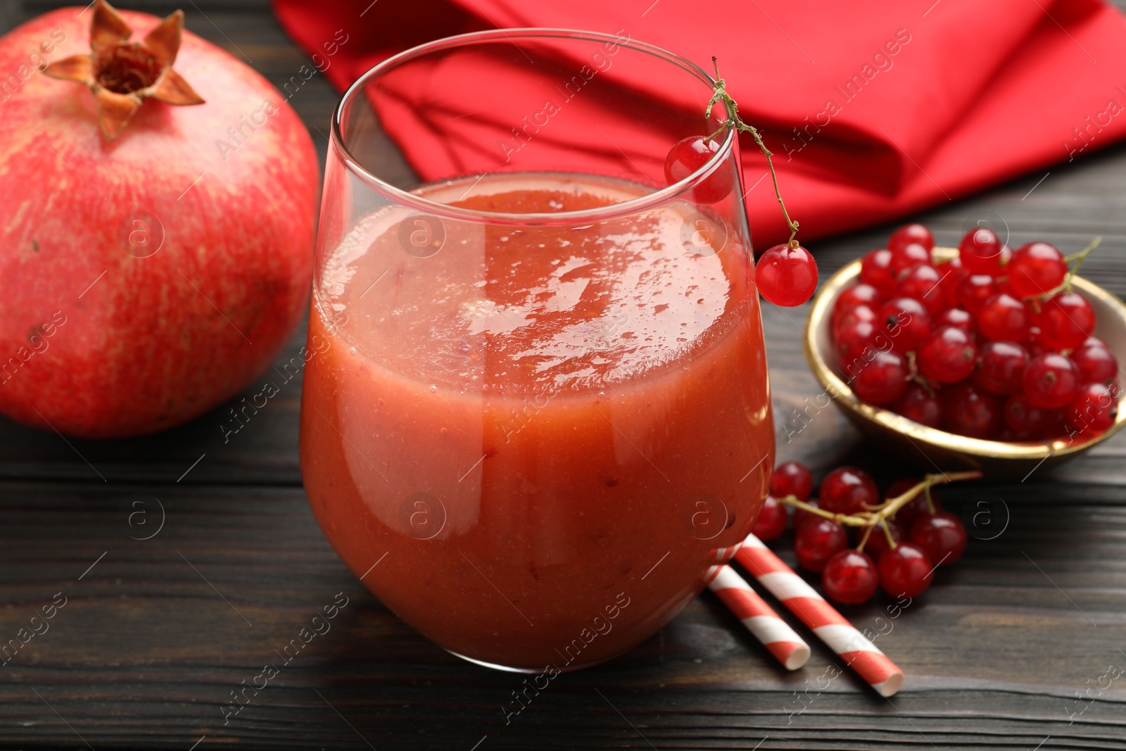 Superfood. Tasty smoothie in glass and ingredients on wooden table, closeup Photo of Superfood. Tasty smoothie in glass and ingredients on wooden table, closeup