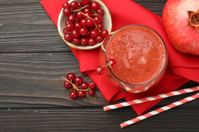 Photo of Superfood. Tasty smoothie in glass and ingredients on wooden table, flat lay. Space for text
