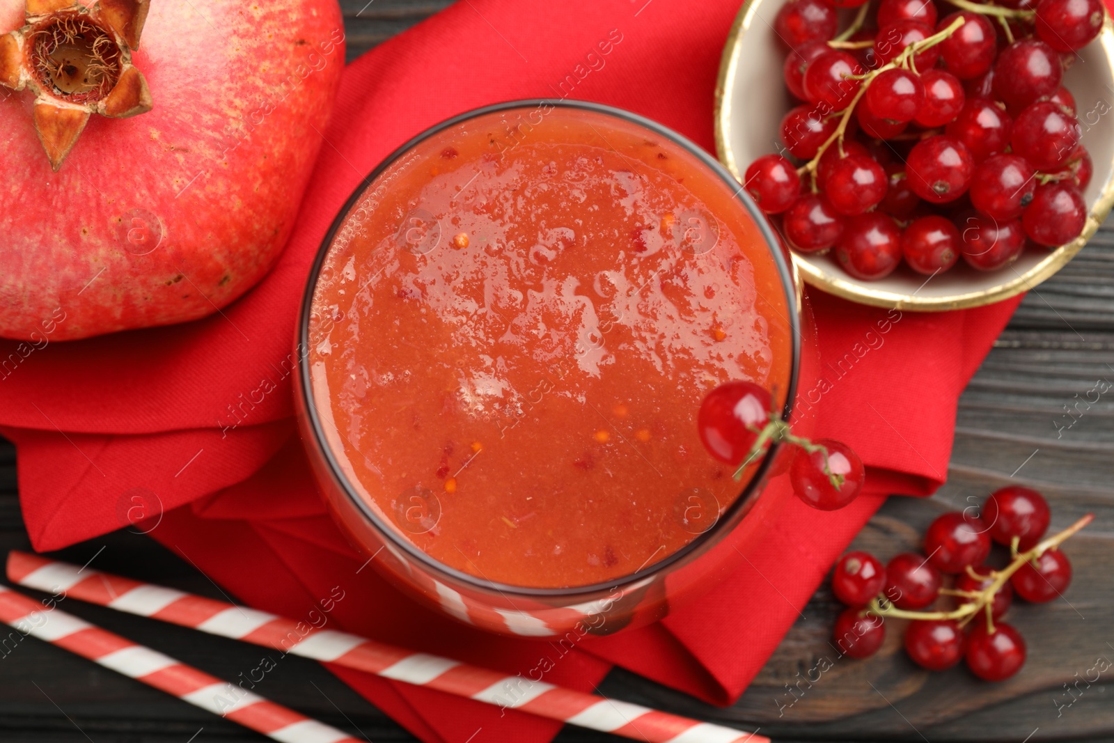Superfood. Tasty smoothie in glass and ingredients on wooden table, flat lay Photo of Superfood. Tasty smoothie in glass and ingredients on wooden table, flat lay