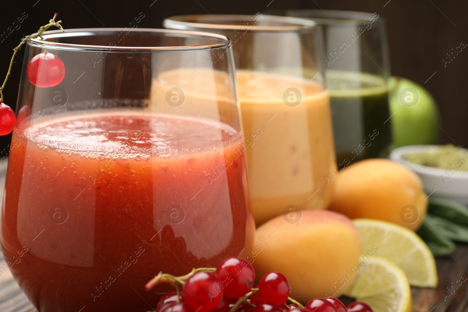 Superfood. Tasty smoothies in glasses and ingredients on table, closeup Photo of Superfood. Tasty smoothies in glasses and ingredients on table, closeup